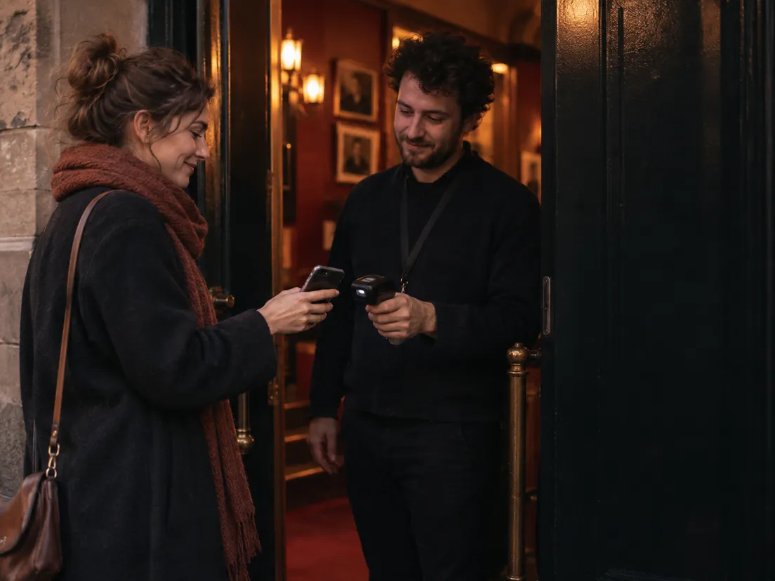 A visitor showing a ticket on their phone at a venue door